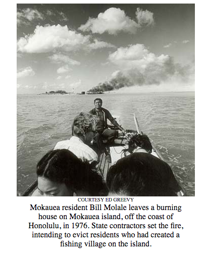 "Mokauea resident Bill Molale leaves a burning house"